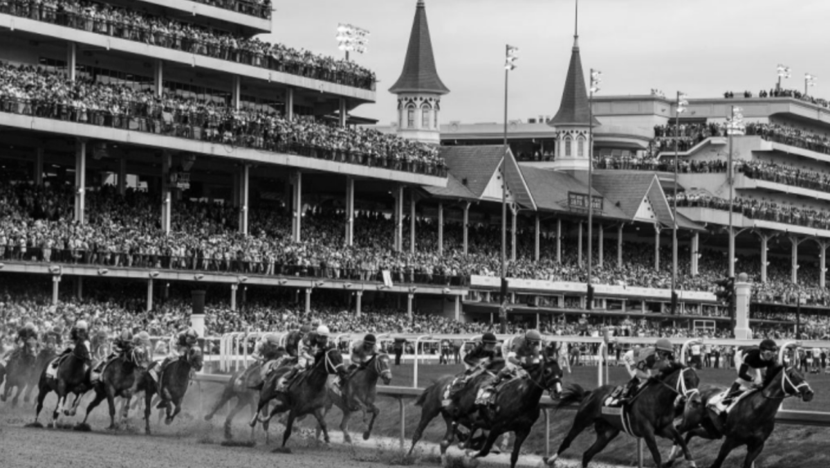 20 horse field for 150th Kentucky Derby rounds the turn during the race.